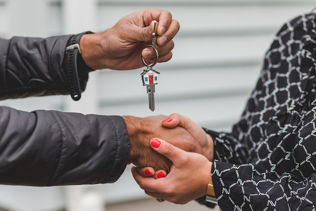 landlord-handing-over-house-keys-to-property-manager