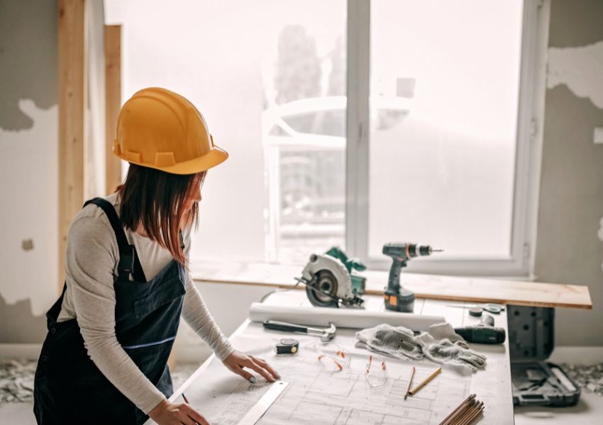 person-completing-renovations-with-table-and-tools