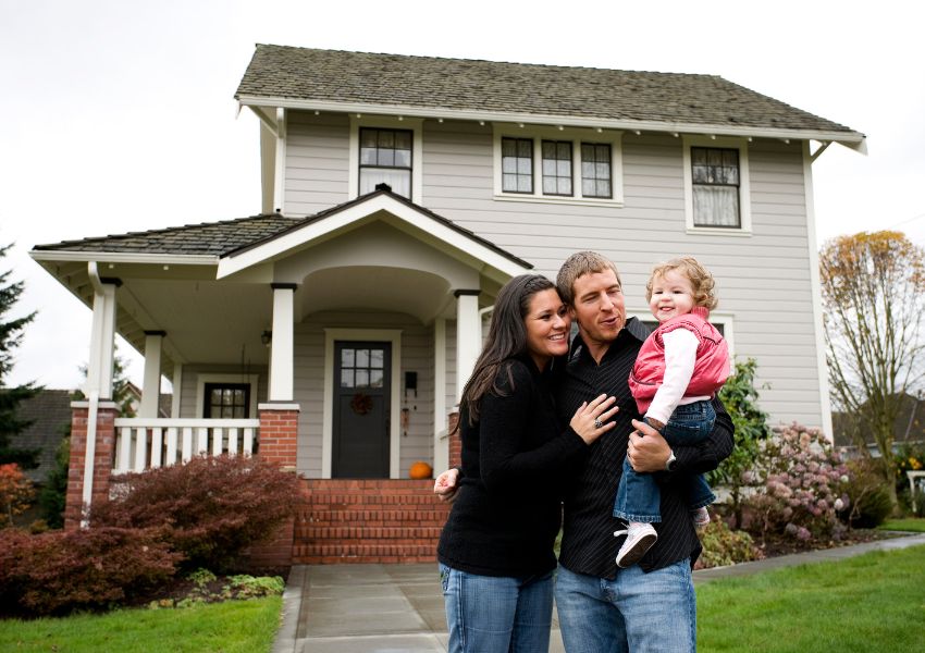 large-home-with-grass-and-family-in-front