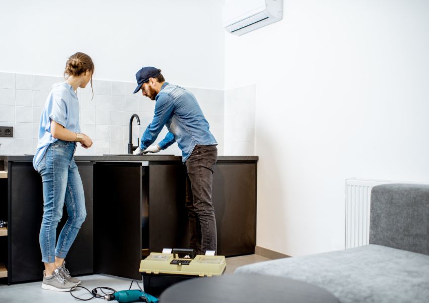 two-people-repairing-sink